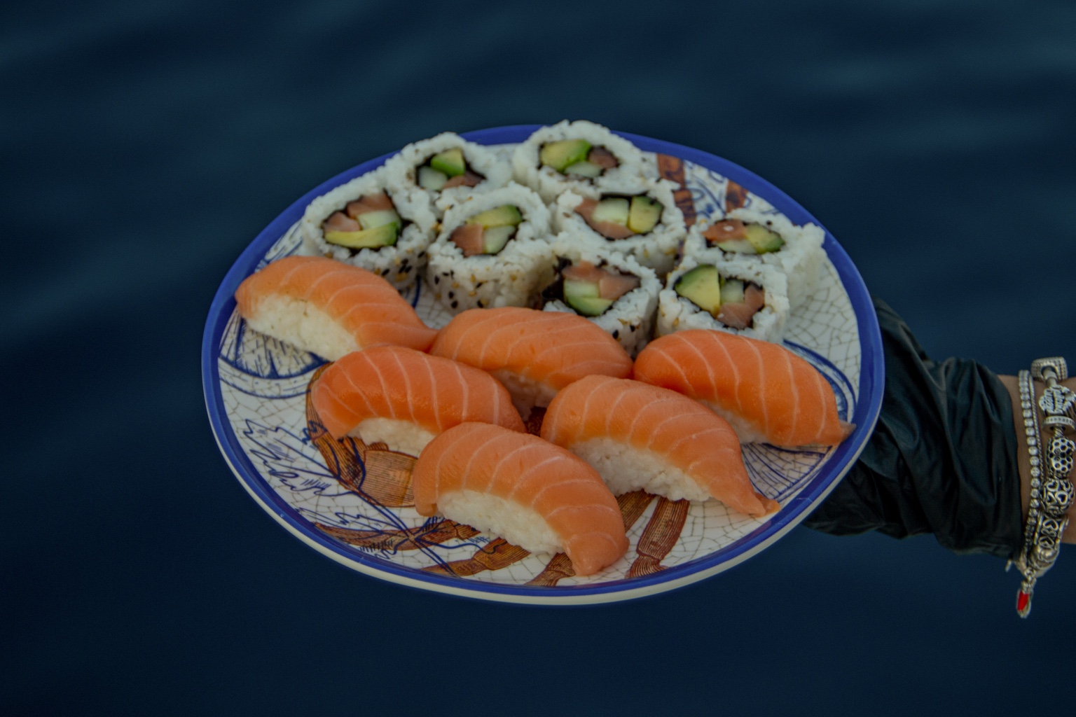 A platter of sushi rolls and salmon nigiri